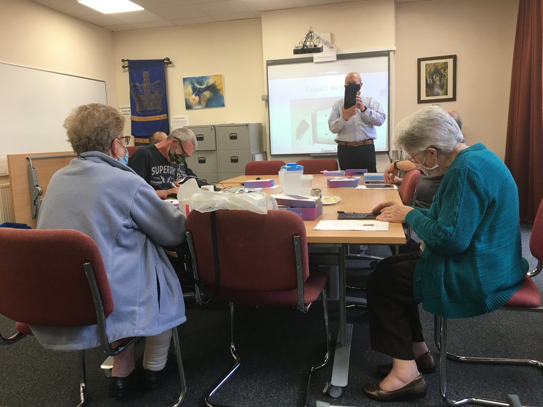 VIC members receiving their first training session on the use of tablets from Veterans Should Not Be Forgotten funding.